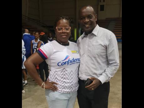 Erica Ewbank (left), the Inter-Secondary Schools Sports Association Chairperson for schoolgirls netball and Principal of Garvey Maceo High School with Principal of Manchester High  Jasford Gabriel at the recent rural area schoolgirls netball semi-finals. 