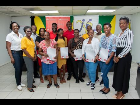 Credit: Contributed Senior management team members at GK General Insurance (GKGI) are pictured with 10 of the 30 female farmers of the Jamaica Network of Rural Women Producers (JNRWP), now protected under the GK Weather Protect policy. Thanks to funding from international don