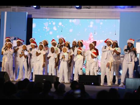 Members of the VoiceBox Performing Arts group performing at Our Christmas Wish on Sunday at the Karl Hendrickson Auditorium at Jamaica College. 