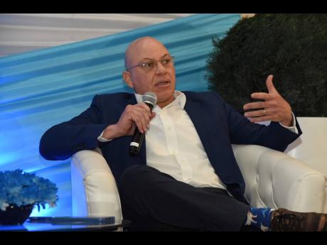 Chairman and shareholder Jeffrey Hall of Lumber Depot Ltd making a point during a conference at AC Marriott Hotel in Kingston last month. 