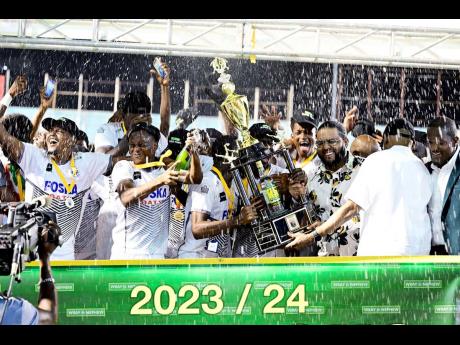 Credit: Cavalier Soccer Club celebrate victory as they are presented with the 2023/24 Jamaica Premier League trophy, after defeating Mount Pleasant Football Academy 4-3 by way of penalty shootout in the final at the National Stadium. Cavalier and Mount Pleasant fa