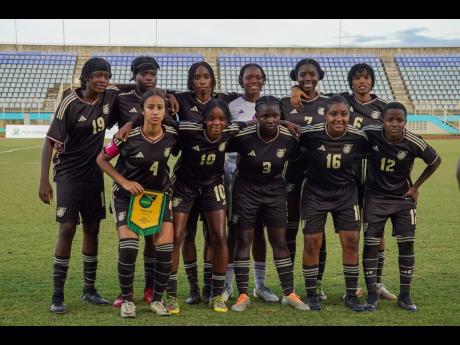 Credit: Courtesy of @jff_football Members of the Under-20 Reggae Girlz team who defeated Dominica 7-0 at the Jewels of the Caribbean U20 Women’s Tournament in Trinidad and Tobago on December 17. At left (front row) is captain Jaileah McPherson.