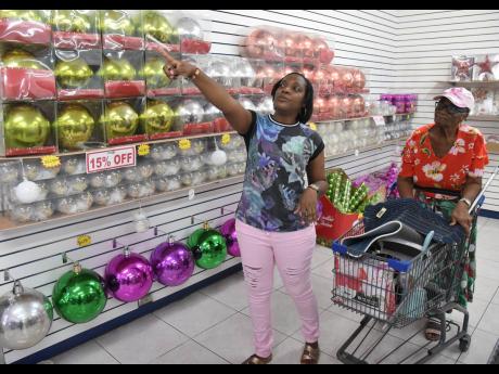 Simone Hanson-Stewart and her mother, Ruby Hanson, shopping for household items last Thursday. The duo, who travelled from Yallahs, St Thomas, said shopping in the capital and the wider Corporate Area has been a family tradition for more than 30 years.