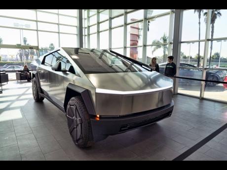 
FILE – A Tesla Cybertruck is on display at the Tesla showroom in Buena Park, California. 