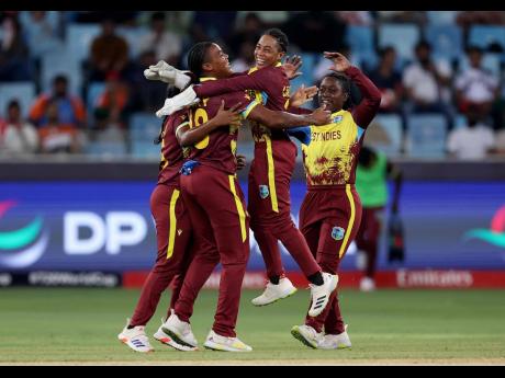 ICC photo 
Chinelle Henry (left) of West Indies Women celebrates with teammates after taking the wicket of Sarah Bryce of Scotland (not pictured) during an ICC Women’s T20 World Cup 2024 at Dubai International Stadium on October 6. Henry top-scored with 