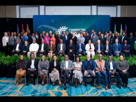 A cross-section of speakers and attendees pose for a family picture at the Connected Caribbean Summit in Miami Florida earlier this month.