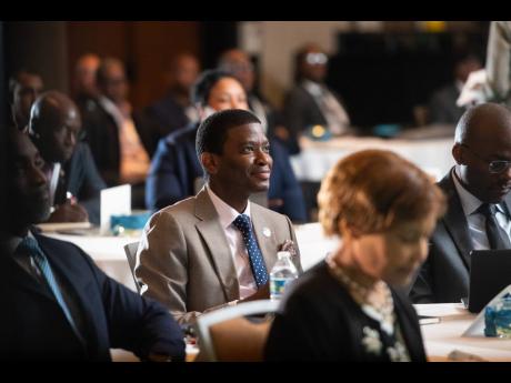 Grenada PM Dickon Mitchell listening to the proceedings at Connected Caribbean Summit 2024 in Miami, Florida.