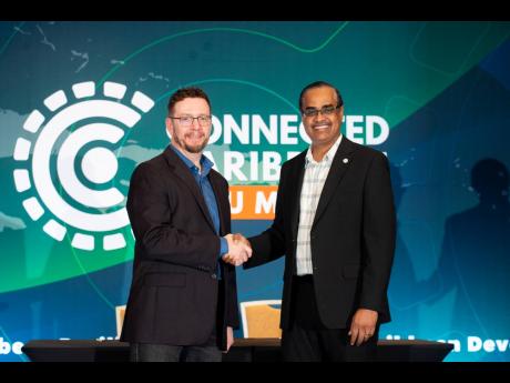 Richard Wall, chief technology officer of Caribbean Agency for Justice Solutions with Jon Phillips, executive director of Washington DC-based Development Solutions Agency after the memorandum of understanding signing between both agencies at the Connected 