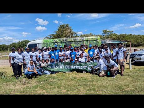The Forestry Department and St Patricks’ Rangers gather for a photo after cleaning up the Old Harbour public beach in St Catherine on International Coastal Cleanup Day, Saturday, September 21, 2024.