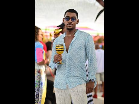 Credit: Contributed Content Creator Rushane ‘RushCam’ Campbell was on theme with a glass of Veuve Clicquot champagne in hand.