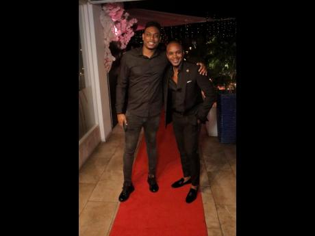Supreme Ventures’ Omar Dattadeen shares a light moment with Kamal Powell. 
