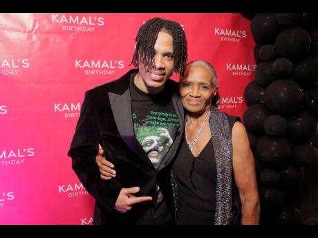 Bonito McDonald (left) greets Monica Plummer with a hug.
