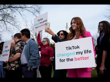 Devotees of TikTok gather at the Capitol in Washington, as the House passed a bill that would lead to a nationwide ban of the popular video app if its China-based owner doesn't sell. 