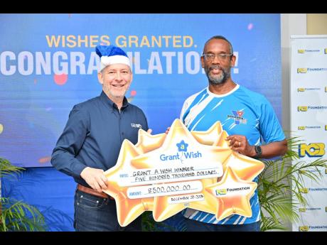 Credit: Contributed left: NCBJ CEO Bruce Bowen (left) hands over a J$500,000 cheque to Allan Marsh, Kingston YMCA Chairman, at NCB Foundation’s Grant a Wish Reveal Ceremony held in Kingston recently. The funds will go toward covering educational programmes for at-risk male