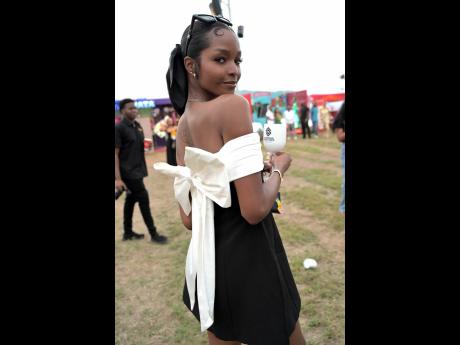 Credit: Rudolph Brown With this stunning bow, Miss Universe Jamaica 2020 Miqueal-Symone Williams lets her style flow in the uber-chic black-and-white dress from BABYBOO.