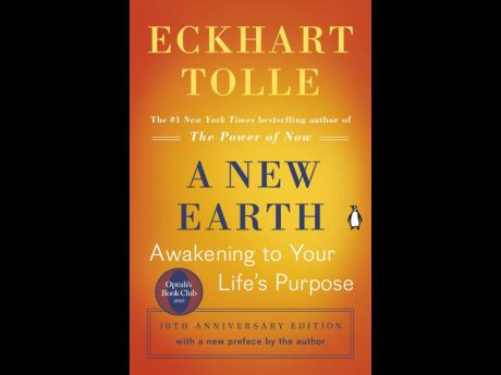 This cover image released by Penguin Life shows ‘A New Earth: Awakening to Your Life’s Purpose’ by Eckhart Tolle.
