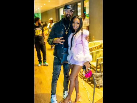 Music producer Mad Suss (left) and recording artiste Marcy Chin checked into the party. 