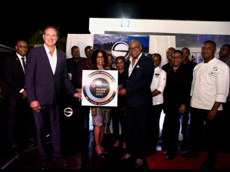 Credit: Ashley Anguin/Photographer The staff at the S Hotel Montego Bay were in a celebratory mood on Wednesday, when it was announced their hotel was again named the No. 1 all-inclusive in Jamaica. Here they share the joyous moment with Minister of Tourism Edmund Bartlett.