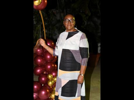 Retired CEO M. Audrey Stewart-Hinchcliffe, chairman of Manpower and Maintenance Services Ltd Group, paused during the celebration of her 85th birthday, to smile for the camera.