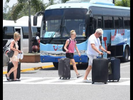 In this 2022 photo, tourists are seen arriving at the Sangster International Airport, Montego Bay.