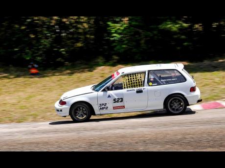 Improved Production 2 champion, Daniel Chok, goes on two wheels on his way to the championship.