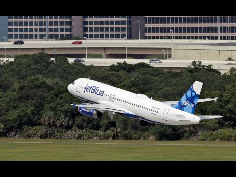 
A JetBlue Airways Airbus A320-232 takes off from the Tampa International Airport in Tampa, Florida, on May 15, 2014.