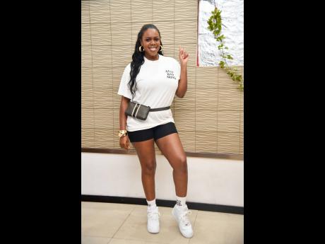 Kaylia ‘Press Kay’ Williams trends in her white ‘Anti Bad Mind’ shirt paired with biker shorts.