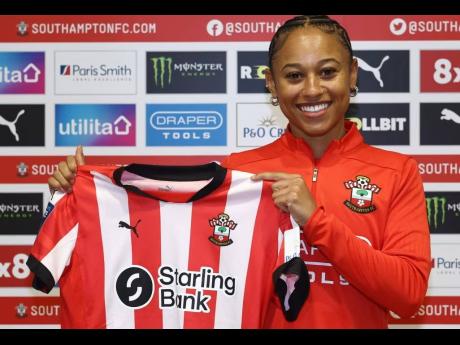 Reggae Girl Siobhan Wilson displays her Southampton kit after signing to the club on loan from Birmingham FC on Friday.
