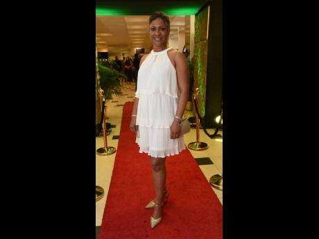 Tanya Tomlinson, director of people, operations and special projects at the Jamaica Public Service, wears a white, ruffled chiffon halter.