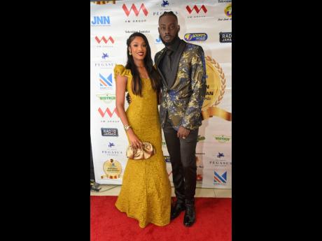 Olympian and hurdler Rasheed Broadbell (right), the 2022 RJRGLEANER National Sportsman of the Year, and belle, fellow Olympian and quarter-miler Stacey Ann Williams, made a golden appearance on the red carpet.