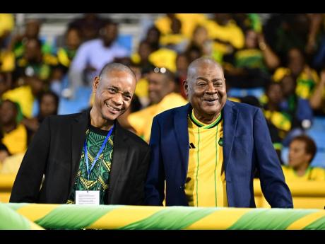 Jamaica Football Federation general secretary Dennis Chung (let) and the organisation’s President Michael Ricketts. 