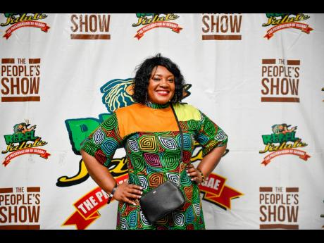 Kaysia Kerr, CEO of the National Parenting Support Commission, is a standout in this intricate African-print design.