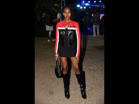 Shauna Williams says she is going for edgy with her red and black biker jacket and knee-high boots.