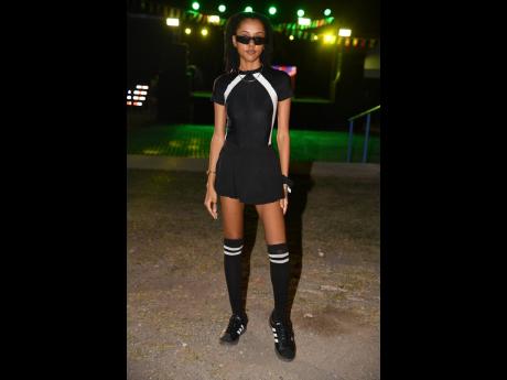 Dana Gooden, social media coordinator,  wore a black Adidas outfit with thigh-high football socks to the sports-themed event.