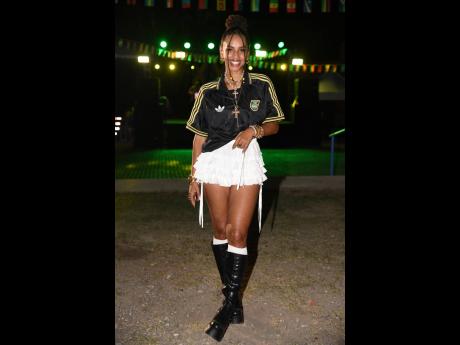 Lindsey Lodenquai, creative director of New Wave, reps in an Adidas jersey with a white mini skirt.