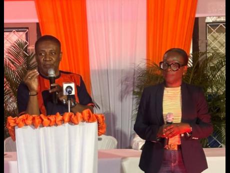 Phillip Paulwell and Janice Allen of the People’s National Party fielding questions at a town hall meeting on their party’s energy policy.