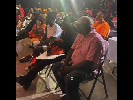 Residents from Central St James in rapt attention at a town hall meeting hosted by the People’s National Party at the Cornwall Court Housing Scheme. 
