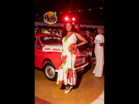 Credit: Contributed Vice-President of Wealth Management at NCB, Karrian Hepburn-Malcolm, effortlessly showcases her cross-shoulder floral-printed dress, paired with silver kitten heels.
