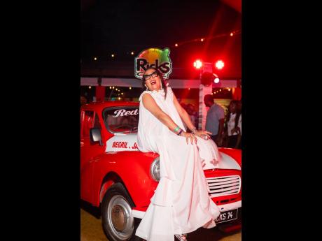 Credit: Contributed Dianne Ashton Smith, Red Stripe head of corporate affairs, stuns in a white ruffled gown with a delicate hemline.