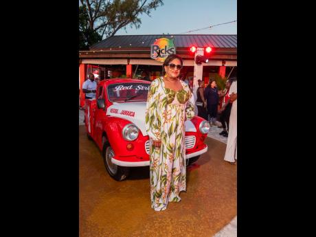 Credit: Contributed Spot on with the ‘Resort Chic’ theme, Joy Roberts, executive director, Jamaica Vacations Limited, stuns in a flowing floral-print dress, perfectly paired with a matching cover-up.