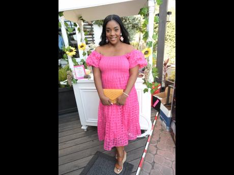 Credit: Rudolph Brown Jody-Ann Ramsay, make-up artist, glowing in her pink, embroidered maxi dress.