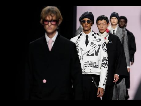 Models wear creations as part of the men’s Louis Vuitton Fall-Winter 2025-2026 collection.