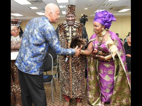 Professor Sir Hilary Beckles (left), vice chancellor, The University of the West Indies, greets His Highness Paul Jones Eganda and his wife, Her Highness Queen Grace Eganda during the CARICOM Reparation Commission Symposium at The UWI’s Regional Headquar