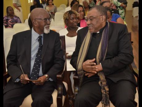 Professor Kwame Dawes (right), Poet Laureate of Jamaica 2025-2028,  shares a moment with Professor Mervyn Morris, Poet Laureate of Jamaica 2014.