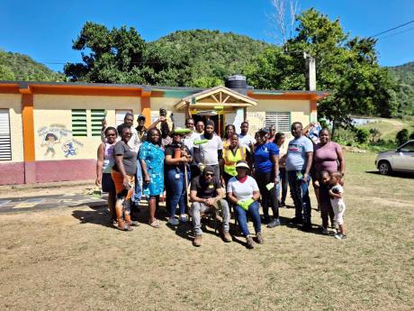 Credit: Contributed The group of volunteers who assembled to renovate the Comfort Hall Primary School.