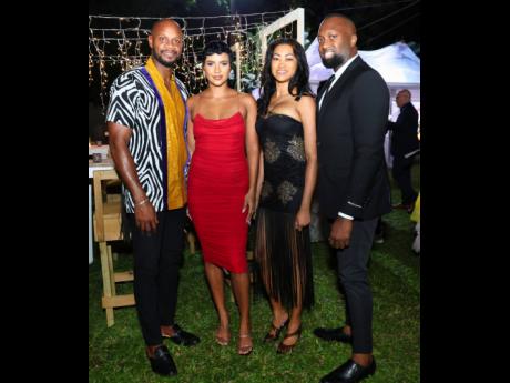 Credit: Contributed From left: Asafa Powell, retired Jamaican sprinter, and his wife Alyshia Powell, model, strike a pose with Carla Lee, fashion designer, and Curt Gardner, director of Gardner’s Tax Consultancy Ltd.