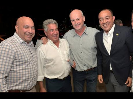 Man of the moment Dr Christopher Tufton (right), health and wellness minister, is joined by (from left) Christopher Zacca, president and CEO of Sagicor Group; Gassan Azan, founder and chairman of MegaMart; and Avraham Rubinchik, general manager of Wastewat