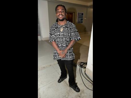 Reggae artiste Jahmiel pauses for a quick photo moments before closing the night with a high-energy performance.