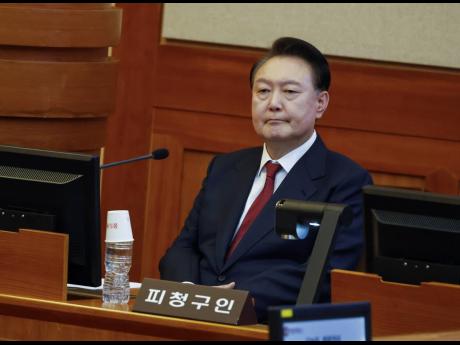 South Korea’s impeached President Yoon Suk Yeol attends the fourth hearing of his impeachment trial over his short-lived imposition of martial law at the Constitutional Court in Seoul.