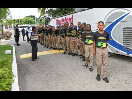 The all-boys grade-6 class of Mico Practising Primary arrives in fine style courtesy of Knutsford Express for the Women’s Leadership Initiative’s’ Conversations With Boys’ workshop at The Jamaica Pegasus hotel on January 15.